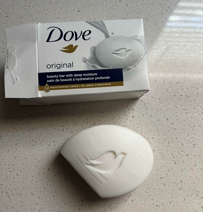 Partially damaged Dove soap bar and packaging, illustrating disappointing shopping fails causing trust issues among buyers.