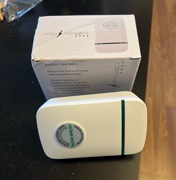 Energy saving device and its box claiming to save electricity, an example of disappointing shopping fails.
