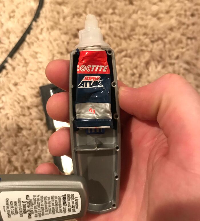 Hand holding a broken item with a tube of glue inside, illustrating disappointing shopping fails and trust issues.