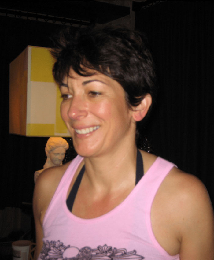 Close-up of a woman smiling indoors, illustrating Ghislaine Maxwell&rsquo;s prison feuds involving alliances and hygiene issues.