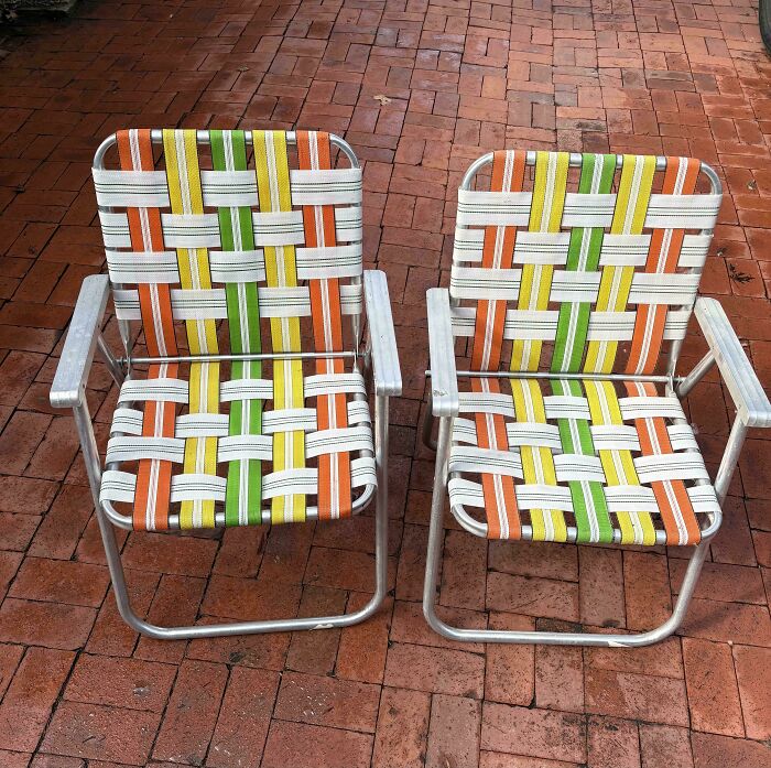 Two vintage folding chairs with colorful woven seats, a perfect jackpot find at a thrift store.