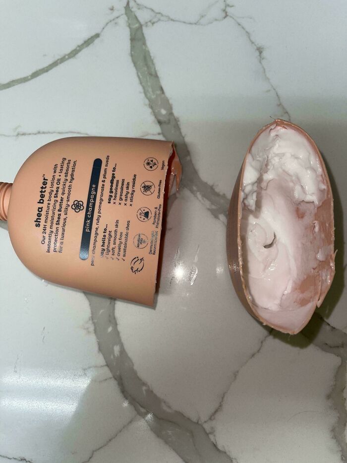 A split lotion bottle revealing a large amount of unused product inside, highlighting insulting consumerism.