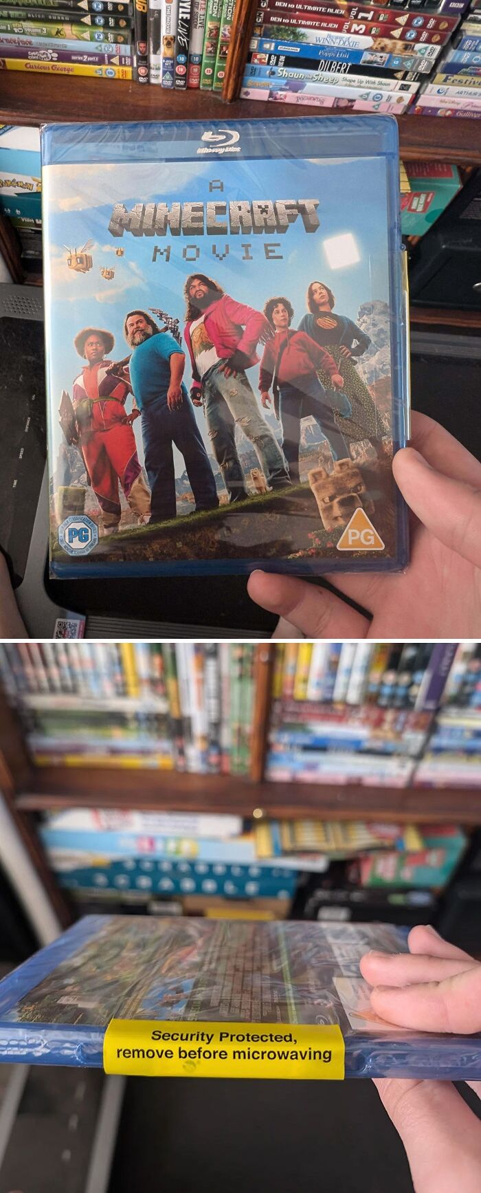 Minecraft movie Blu-ray with security sticker saying remove before microwaving, illustrating you had one job fails.