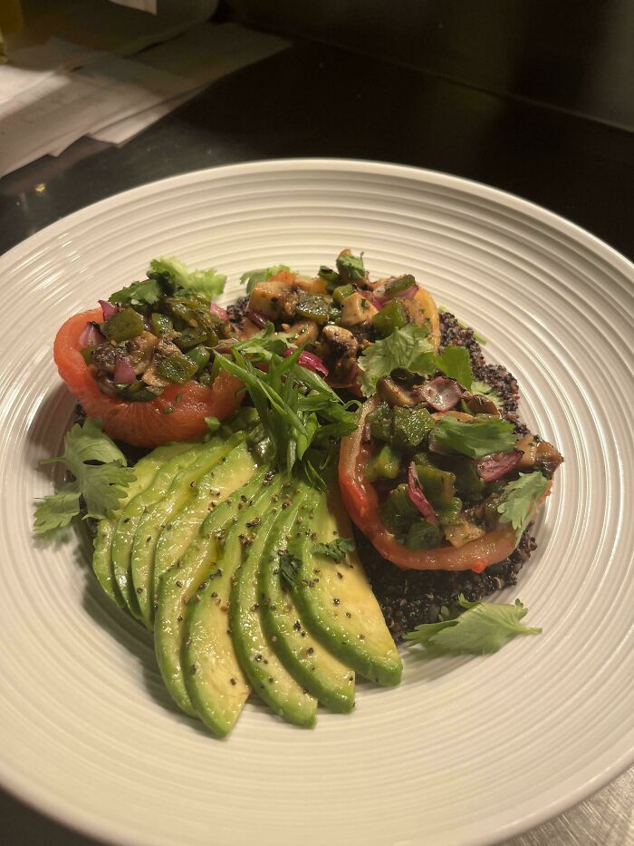 Plated fresh avocado and vegetable dish showcasing unique weird and unhinged family traditions food presentation.
