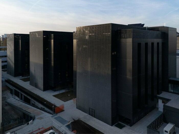Four dark, imposing buildings that look like they belong to an evil mastermind planning world domination.