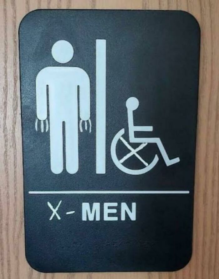 Bathroom sign altered to add claws to the figure and label it X-Men, an example of mild vandalism for humor.