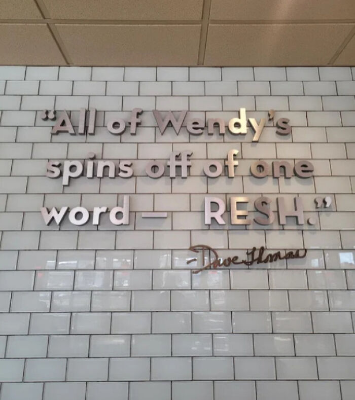 Wall text with a mild vandalism twist showing a quote with missing letters, illustrating mild vandalism humor.