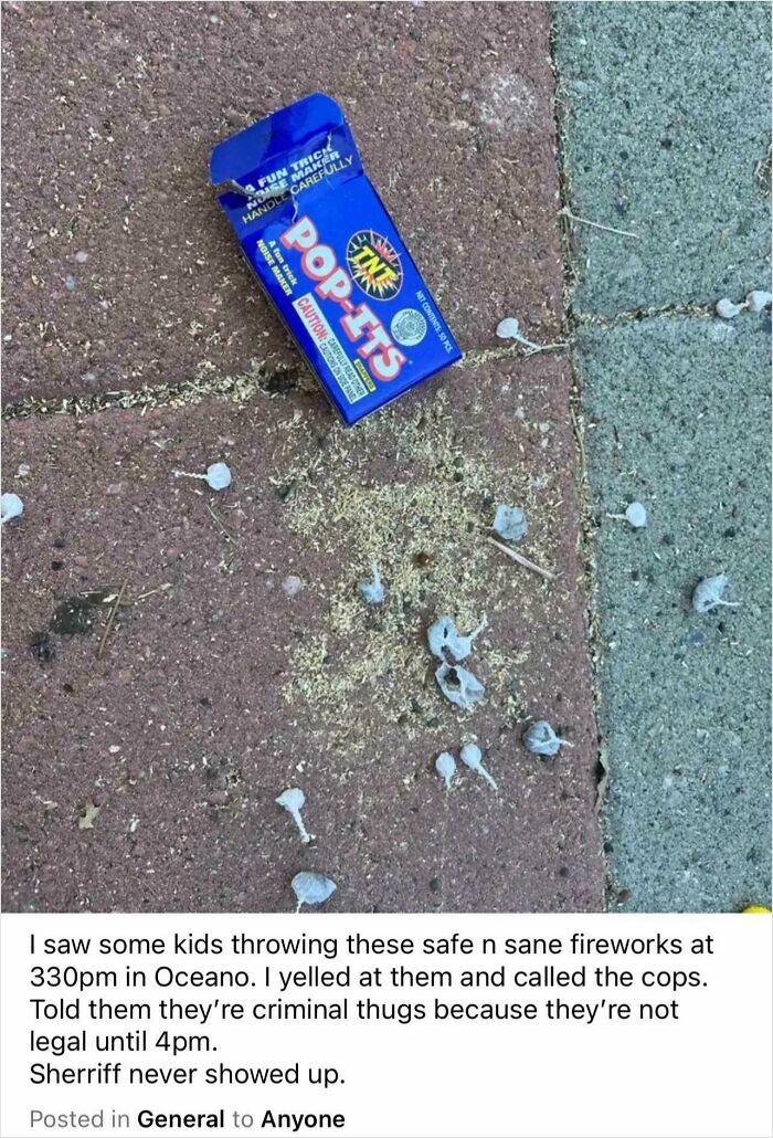 Blue Pop-Its firework box discarded on a sidewalk with debris, illustrating entitled Karen behavior called out online.