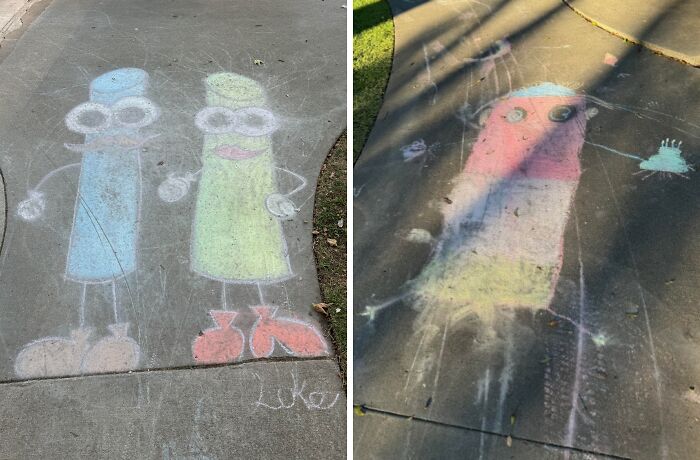 Sidewalk chalk drawings of cartoon figures created by children on a concrete path, showing colorful playful art.
