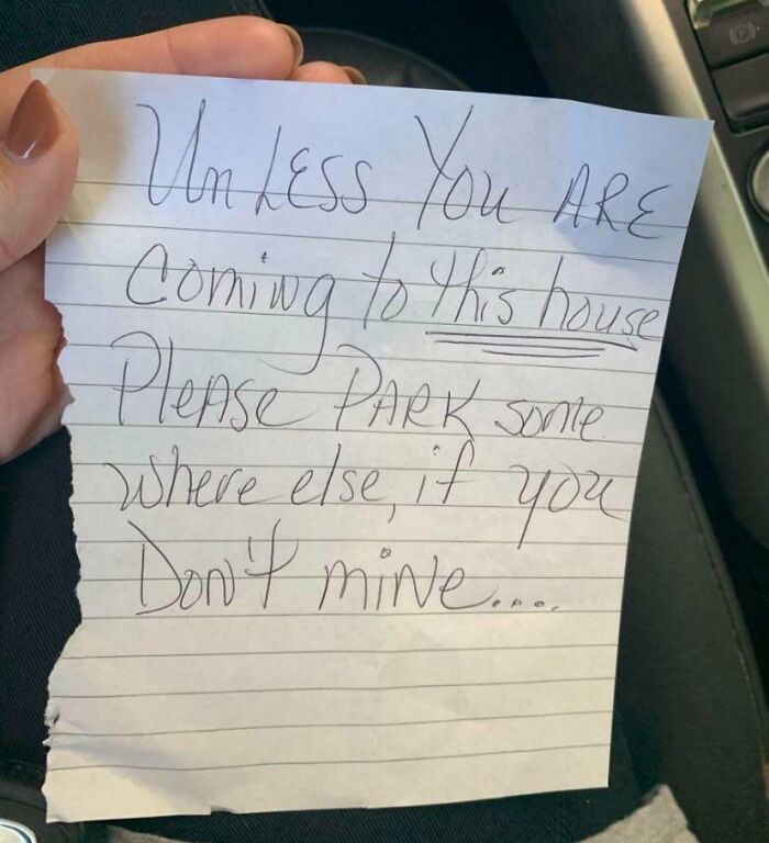 Handwritten note demanding parking only for visitors, showcasing entitled Karen behavior missing a sense of shame.