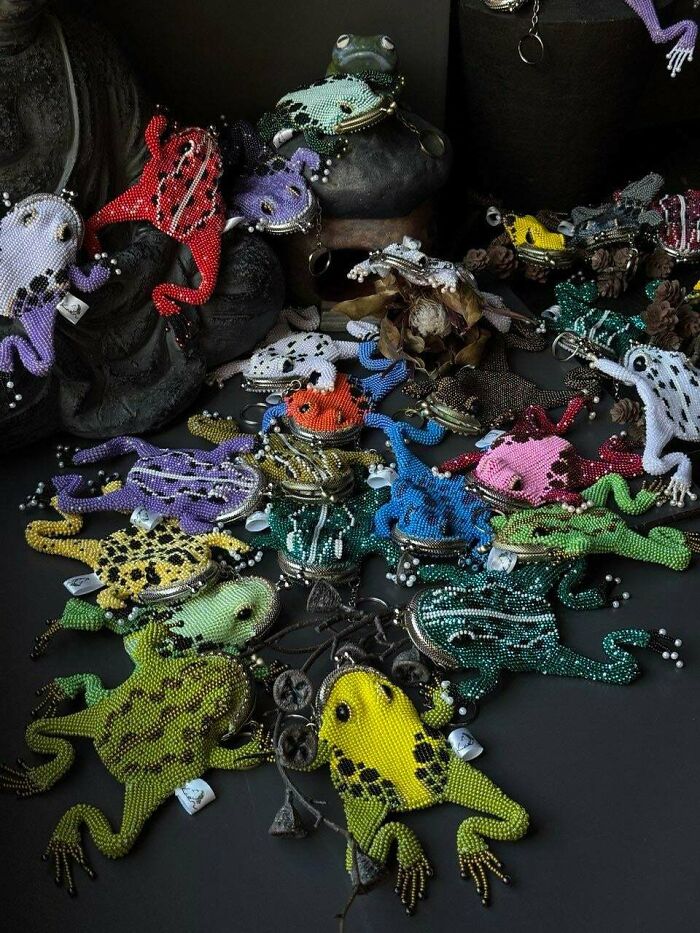 Colorful handmade beaded frog crafts displayed on a dark surface, showcasing intricate DIY wins and creative healing projects.