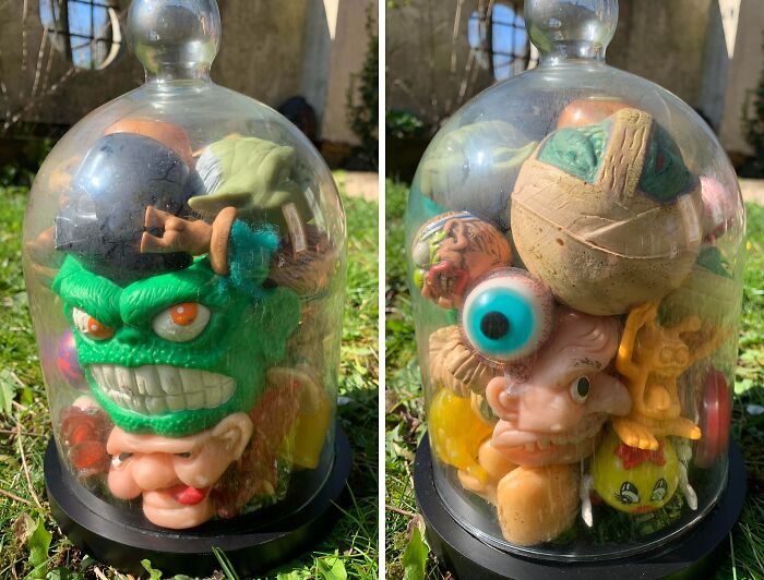 Collection of unique and quirky collectible toys displayed under a glass dome, showcasing an obsession turned collection.