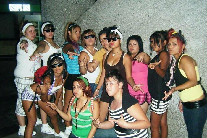 Group of teens dressed in 2010s fashion posing together, capturing nostalgic vibes from the early 2010s era.