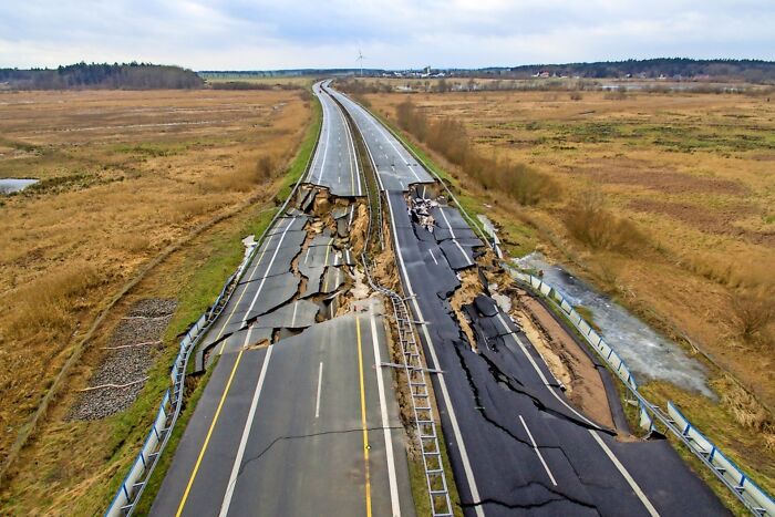 Aerial view of a highway disaster with severe road cracks and collapse showing what could go wrong with infrastructure.