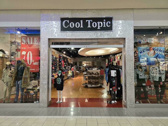 Clothing store Cool Topic with mannequins and apparel, showcasing a shameless copy of famous brand styles.