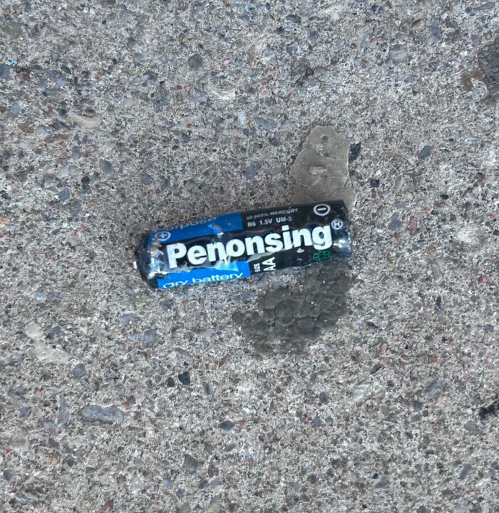 Battery labeled Penonsing on rough concrete surface, illustrating shameless times designers copied famous brands.
