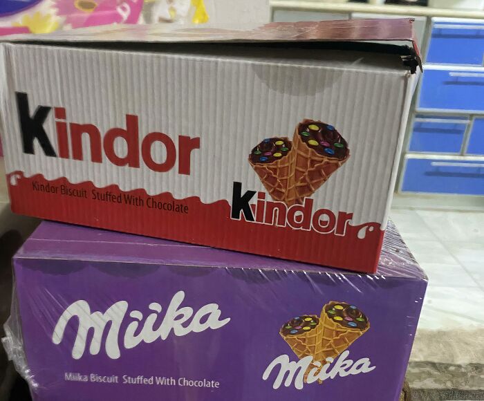 Boxes of biscuits mimicking famous brand packaging with altered names and similar design, showing shameless brand copying.