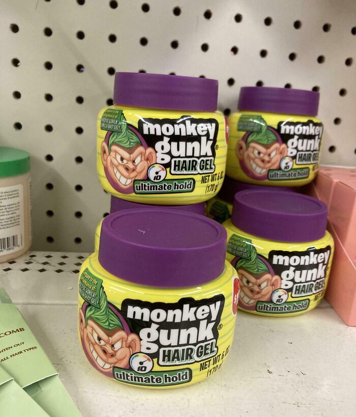 Monkey Gunk hair gel jars with purple lids on a store shelf, showcasing shameless brand copying by designers.