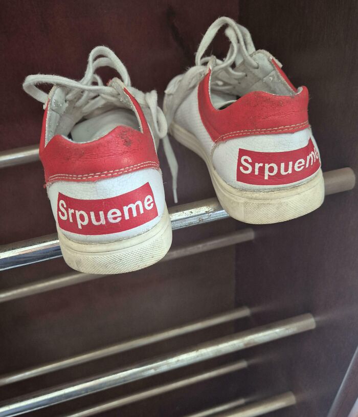 White and red sneakers with a spoof brand logo Srpueme, showcasing shameless times designers copied famous brands.