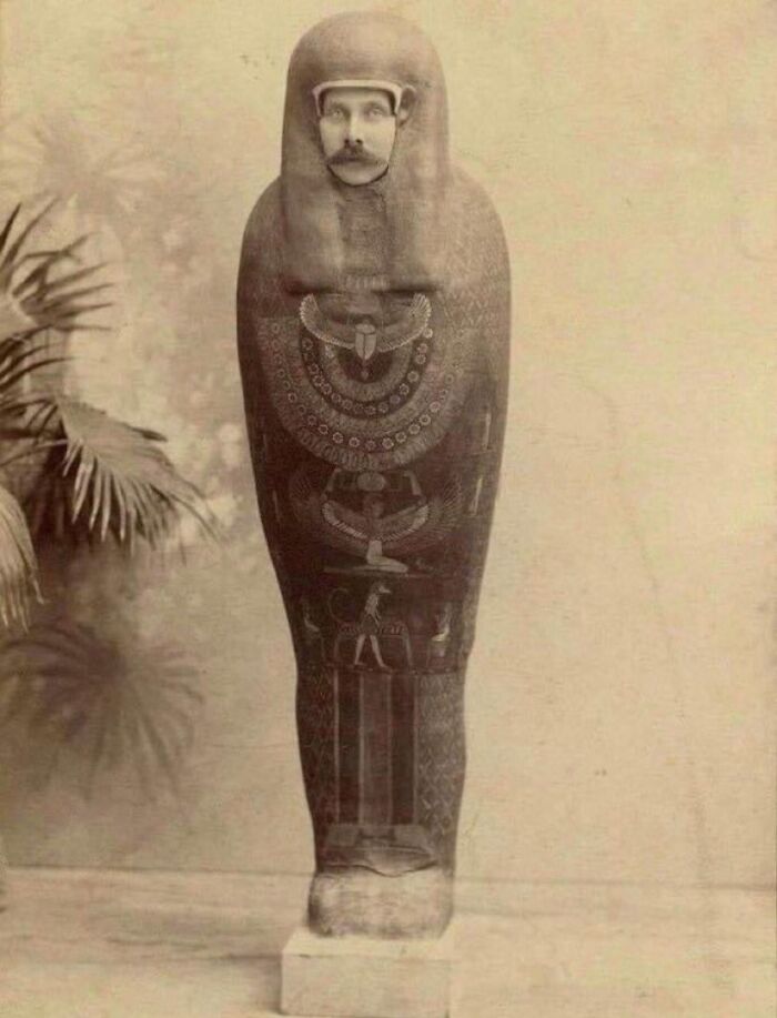Man dressed as ancient Egyptian sarcophagus in bizarre throwback moment from early 1900s vintage photo.