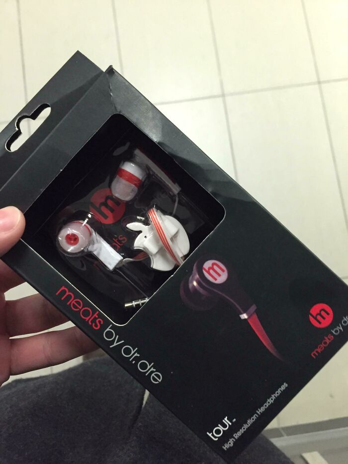 Package of shamelessly copied brand earbuds labeled meats by dr dre, highlighting hilariously shameless times designers copied famous brands.