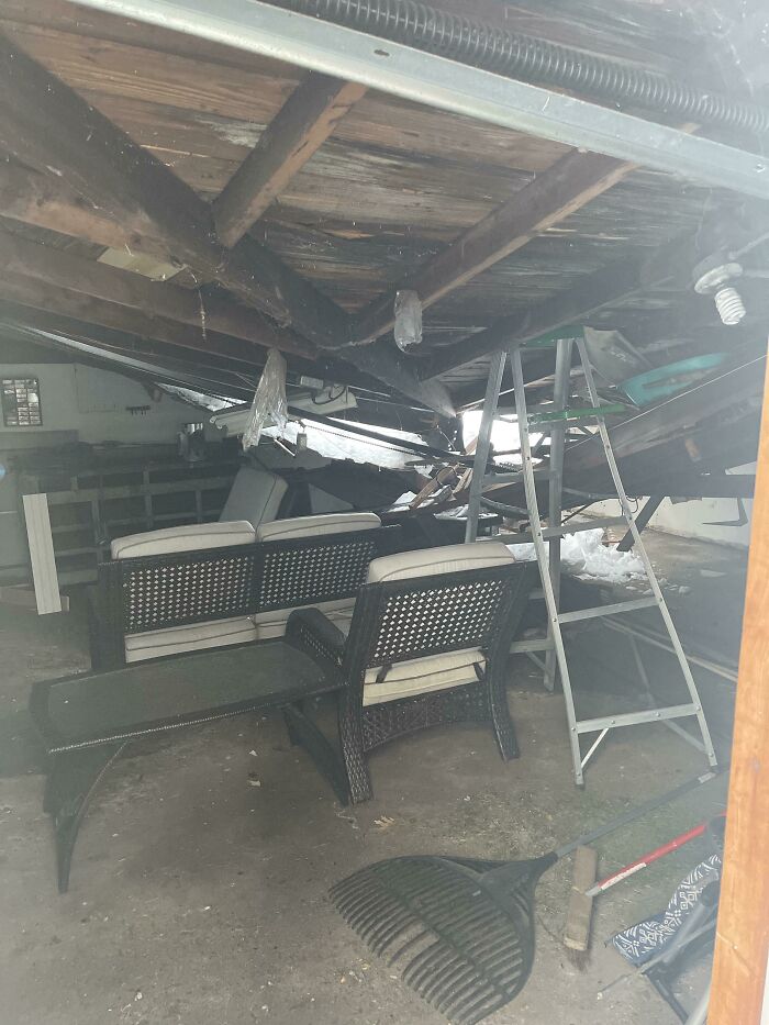 Collapsed ceiling inside a home with furniture and a ladder, illustrating home buying regrets after structural damage.