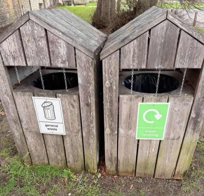 Two wooden bins for general waste and mixed recycling outdoors, showcasing internet solving mystery of unidentified objects.