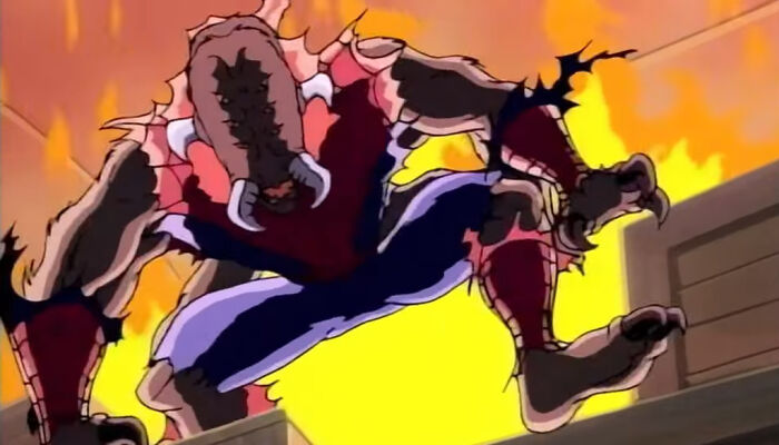 Spider-Man in a monstrous form with broken powers, leaping amid flames in an intense animated scene.