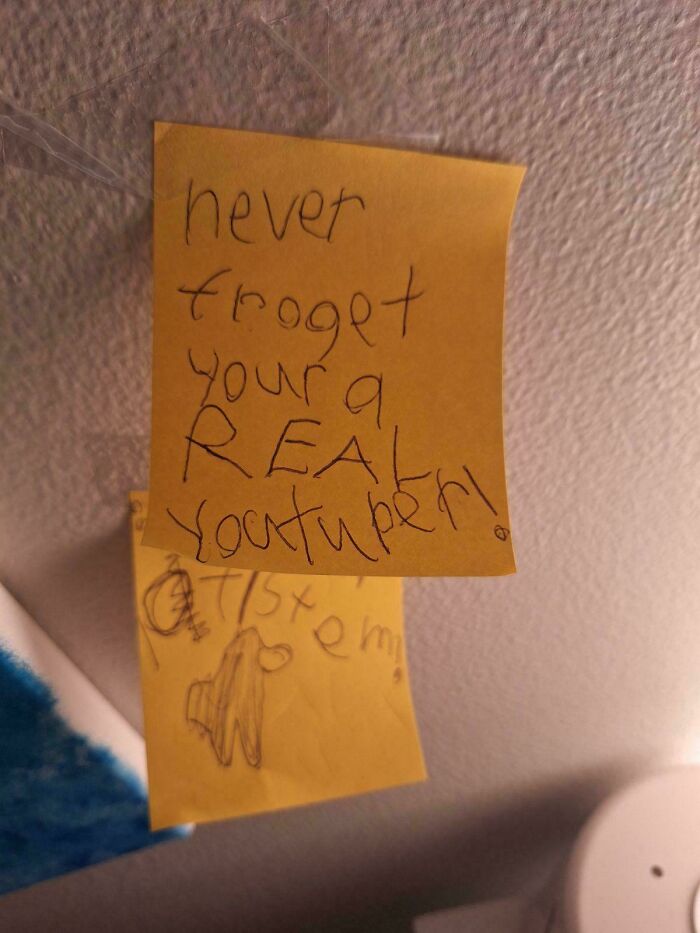 A handwritten note on a sticky pad, 'never froget your a REAL youtuber!', reflecting a funny and goofy great dad moment.