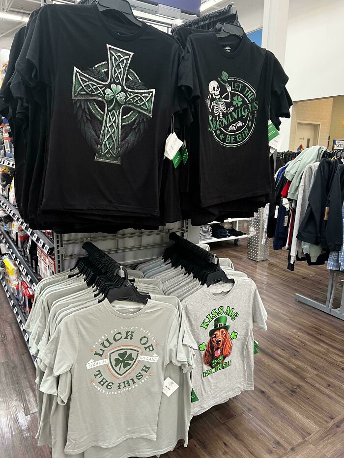 A store display with various St. Patricks Day shirts, an example of insulting consumerism.