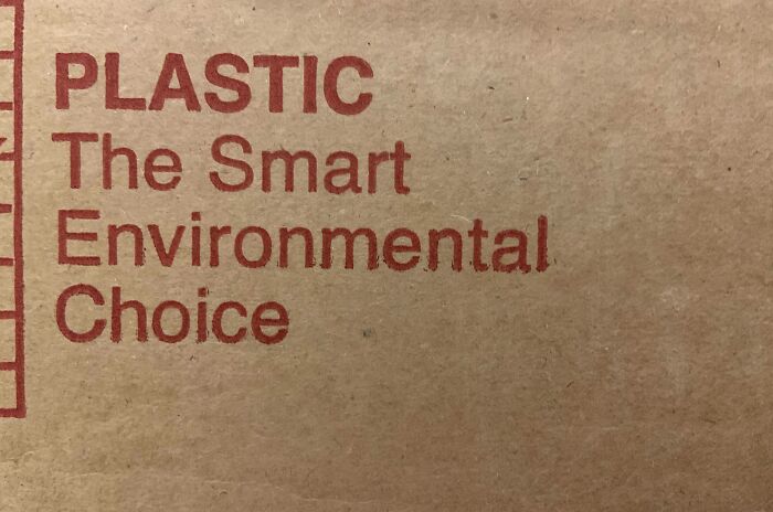 Old photo of a cardboard box with ironic text about plastic being the smart environmental choice.
