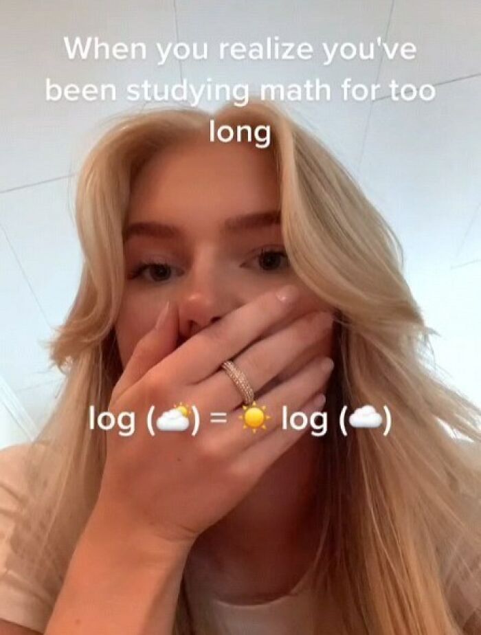 Young woman covering her mouth with hand, reacting to a math meme about logarithms, highlighting entertaining memes.