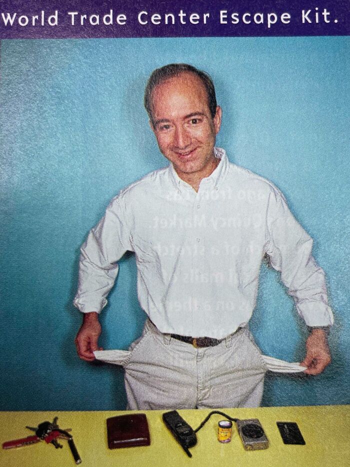 Man in old photo showing empty pockets with World Trade Center escape kit items on table, reflecting aged items.