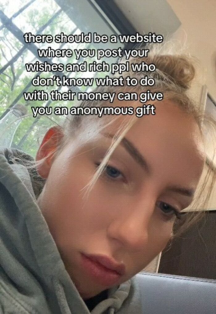 Close-up of a person with a meme about a website for posting wishes and receiving anonymous gifts, entertaining meme content.