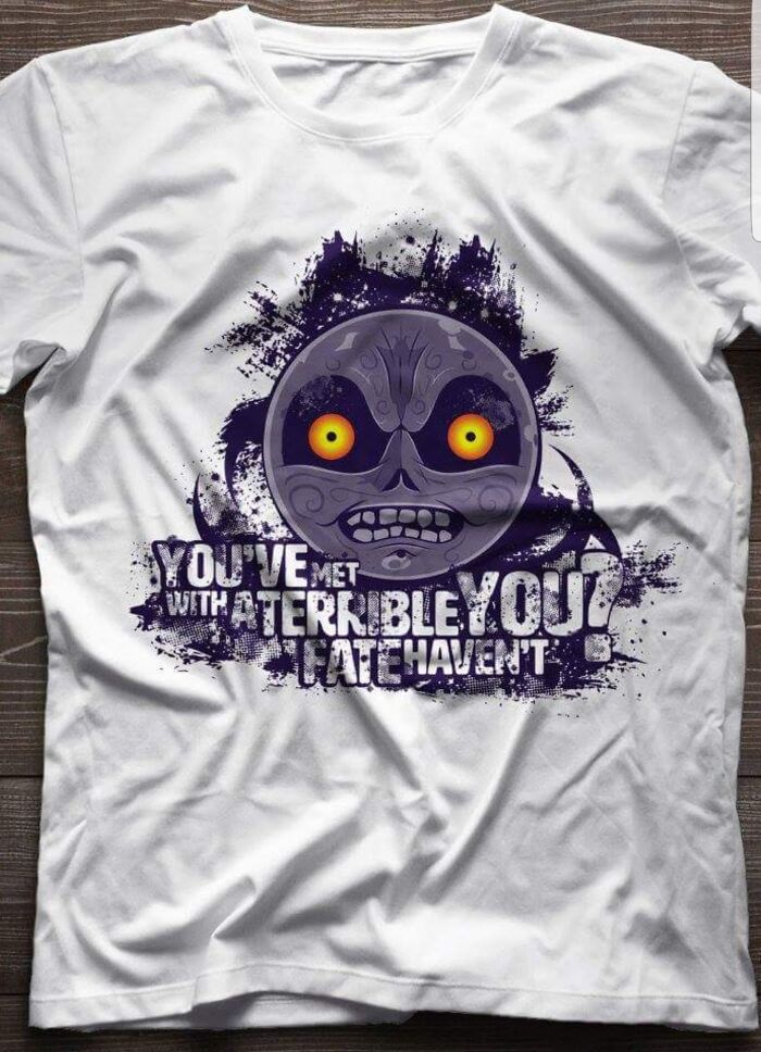 White T-shirt with a bizarre face graphic and humorous text showing hilariously bad T-shirt design.