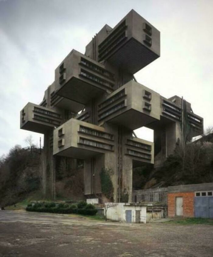 Brutalist urban hell architecture with large concrete block structures