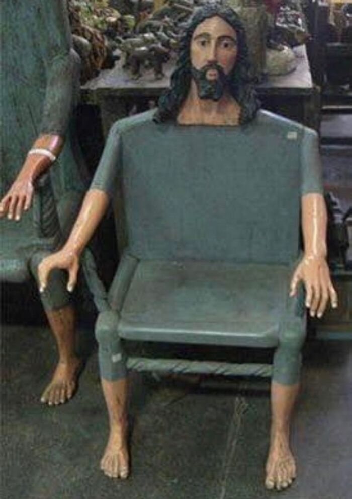 Wooden chair designed with human legs, arms, and a bearded head, an unhinged Facebook Marketplace find.