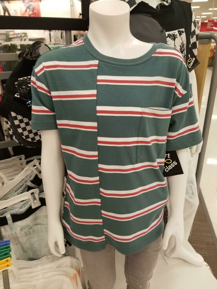 Green and white striped T-shirt with a misaligned pattern on a mannequin, an example of bad T-shirt designs.