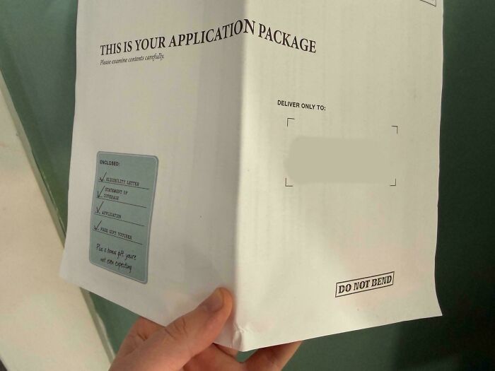 Hand holding an application package with contents checklist, addressed on a white envelope marked Do Not Bend.