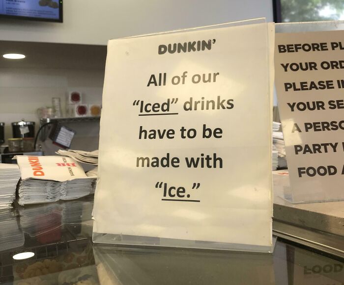 Sign at Dunkin using quotation marks around iced and ice, creating a hilariously suspicious message about drinks and ingredients.