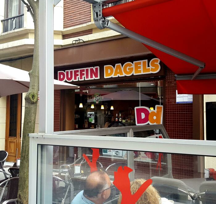 Storefront of Duffin Dagels bakery with signage mimicking famous brand designs in a humorous shameless copy attempt.