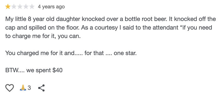One-star absurd review from an entitled customer confused about simple charges and spilled root beer incident.