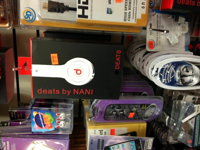 Packaging of shamelessly copied Beats headphones labeled deats by NANI displayed among other electronics accessories.