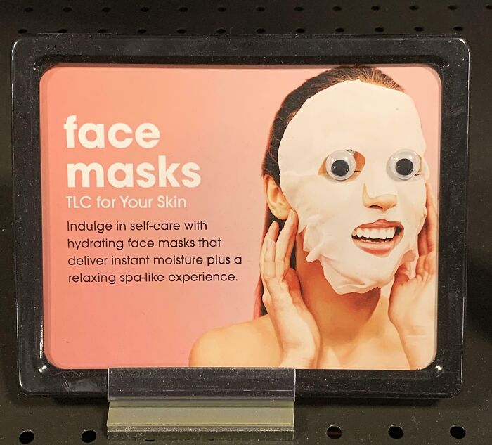 Face mask display with mild vandalism, featuring googly eyes added for lighthearted mild vandalism humor.