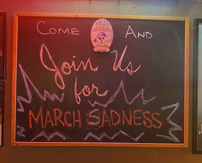 Chalkboard with a funny mild vandalism message inviting to join for March Sadness at a restaurant.