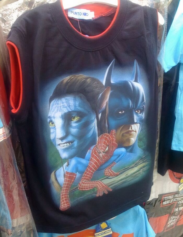 Black t-shirt featuring a hilariously bad design blending Avatar, Batman, and Spider-Man characters.