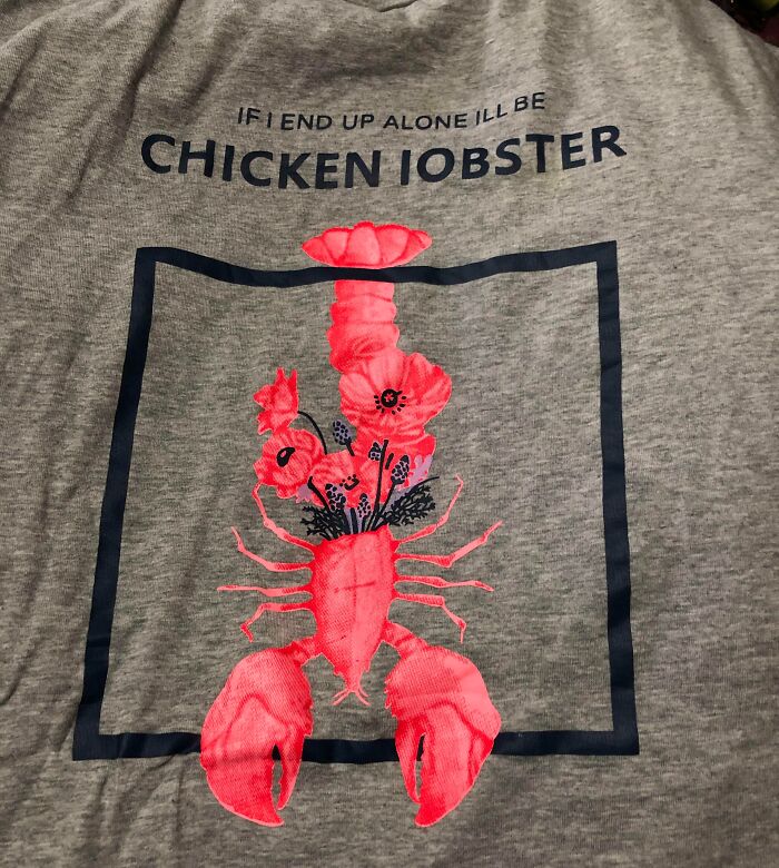 Gray t-shirt with a hilariously bad design of a lobster labeled as chicken lobster, featuring flowers inside the lobster.