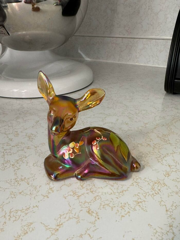 Iridescent glass deer figurine with floral details, a creative glass item perfect for unique home decor.