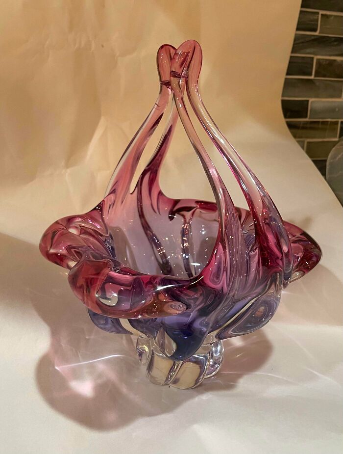 Unique purple and clear cool and creative glass item with artistic twisted design for home decor display.