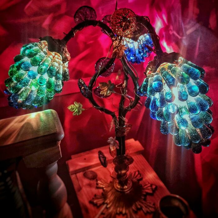 Decorative glass grape cluster lamp with blue and green glass grapes creating colorful home decor lighting.